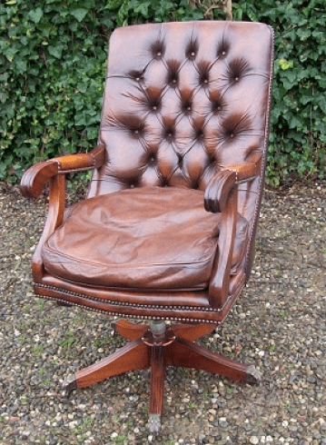An Executive Brown Leather Swivel Chair - SOLD -