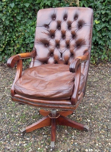 An Executive Brown Leather Swivel Chair - SOLD -