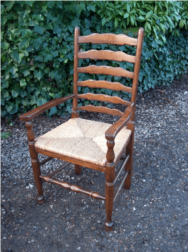 A Set of 7 Oak Ladder Back Chairs