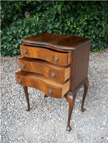 A Three Drawer Chest on Cabriole Legs