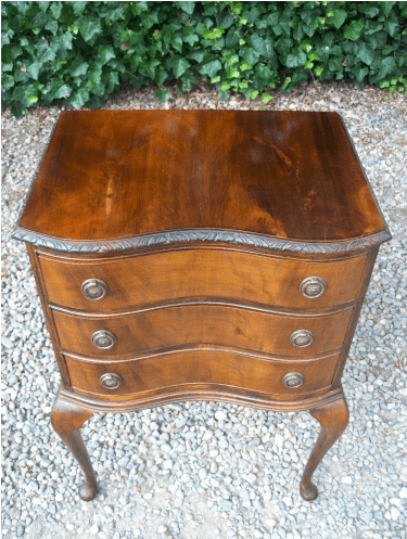 A Three Drawer Chest on Cabriole Legs