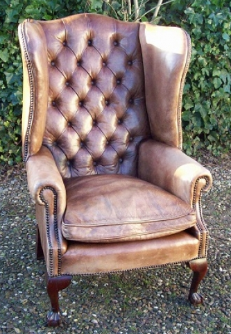 A Beige Leather Wing Chair