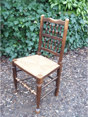 A Set of 8 Oak Spindle Back Chairs