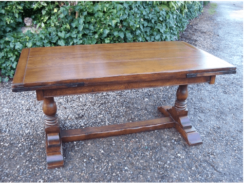 An Oak Extending Refectory Table -SOLD-