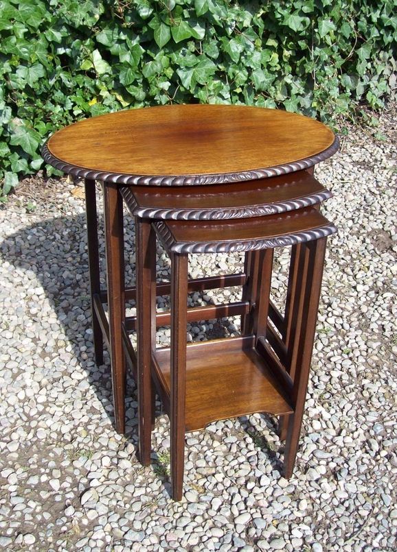 A Nest of Three Mahogany Tables