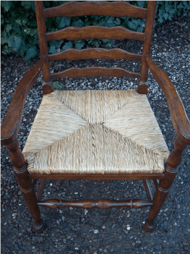 A Set of 7 Oak Ladder Back Chairs