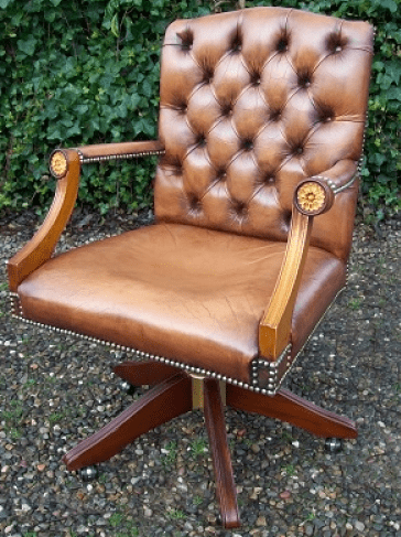 A Caramel Brown Leather Swivel Chair