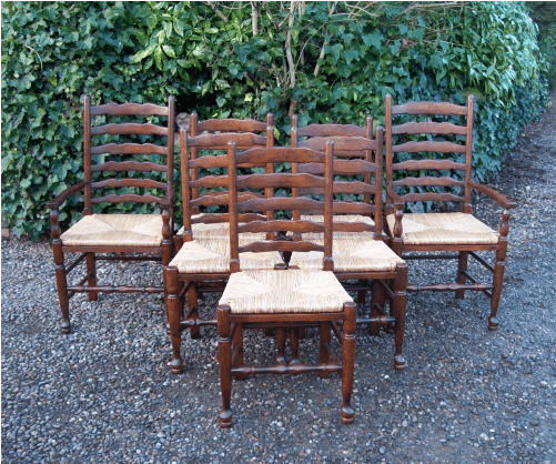 A Set of 7 Oak Ladder Back Chairs