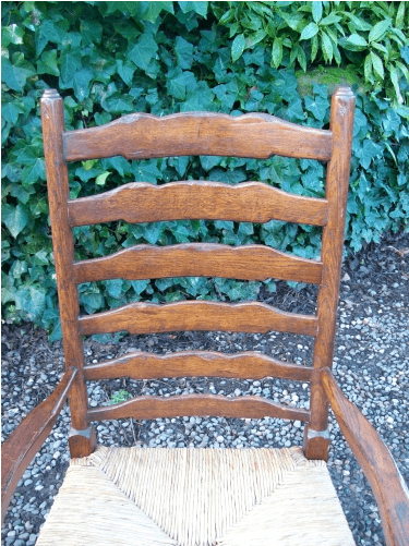 A Set of 7 Oak Ladder Back Chairs