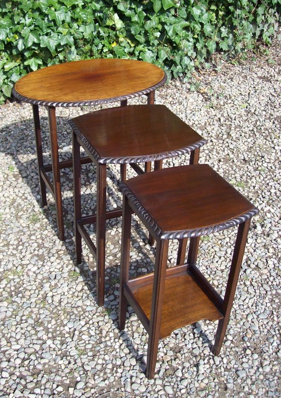 A Nest of Three Mahogany Tables